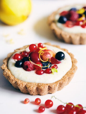 Berry tarts on a marble counter