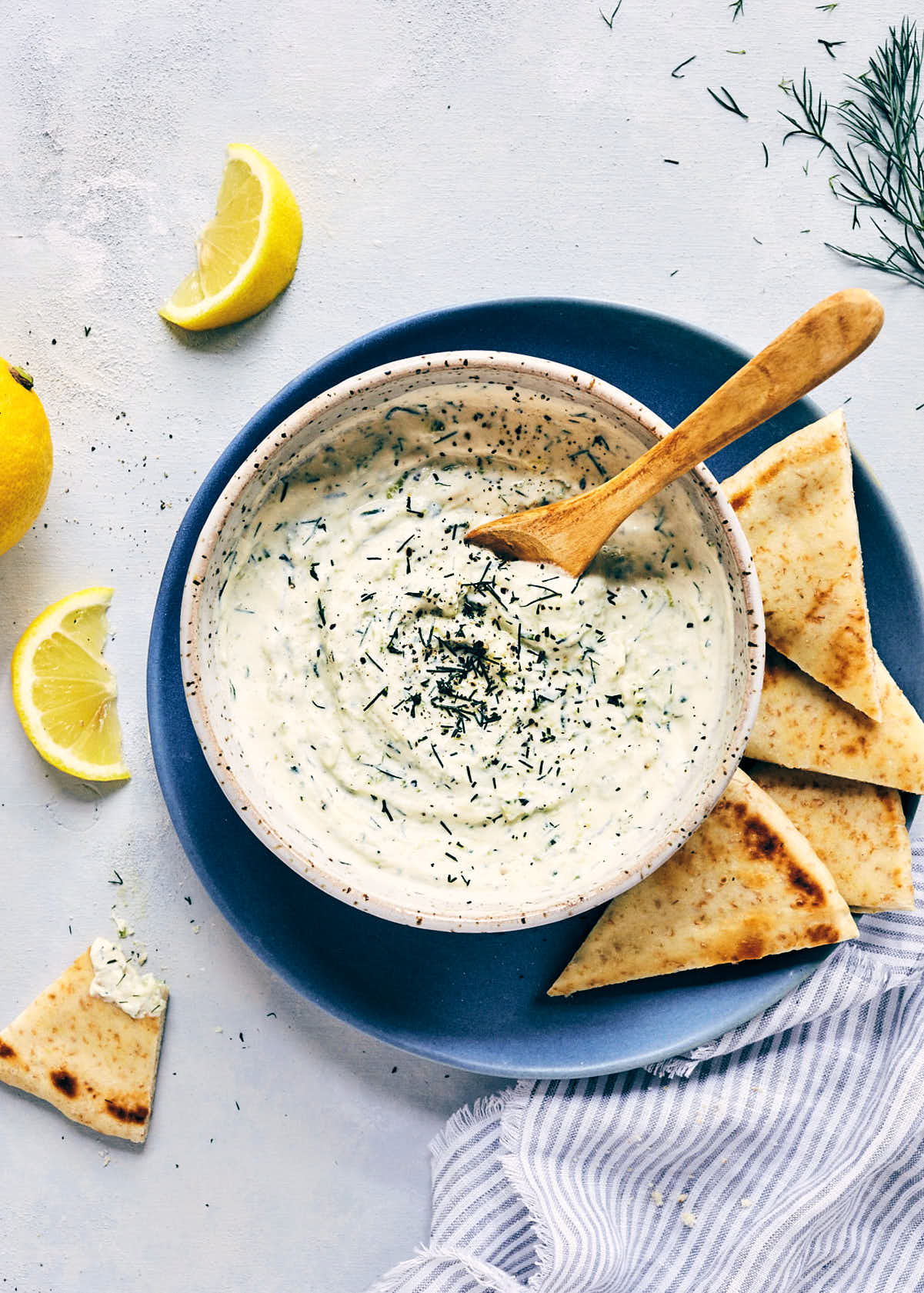 Bowl of vegan tzatziki with bread for dipping