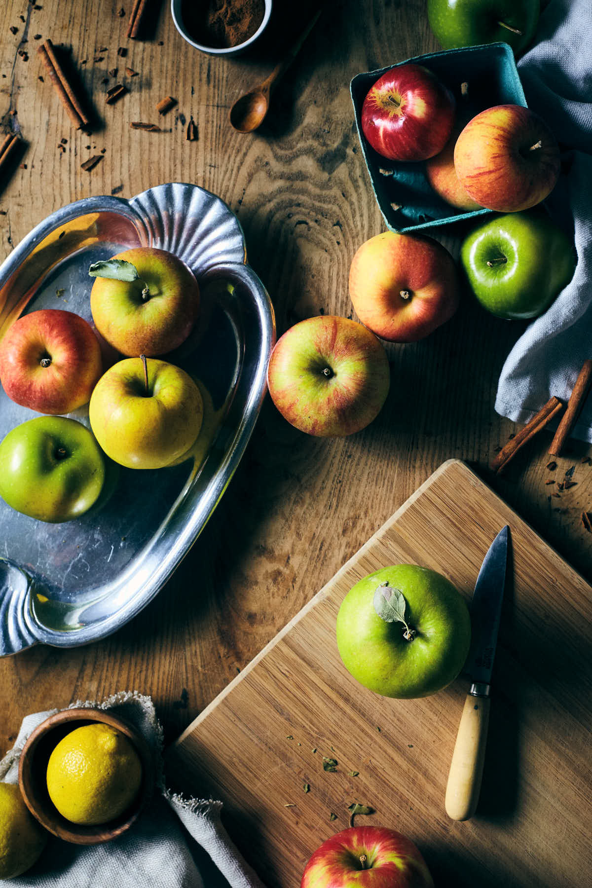 Apples on a cutting board before being cut into filling