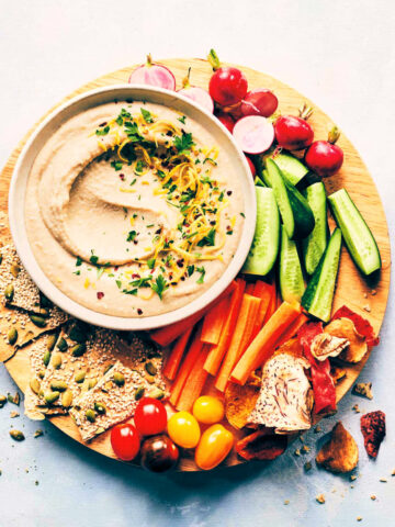 Platter with fresh veggies, crackers and white bean dip