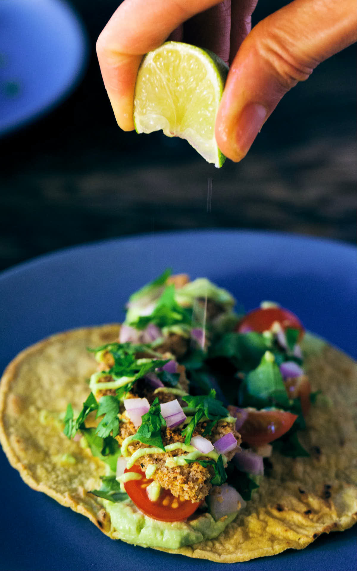 Dressing squash taco with fresh lime juice