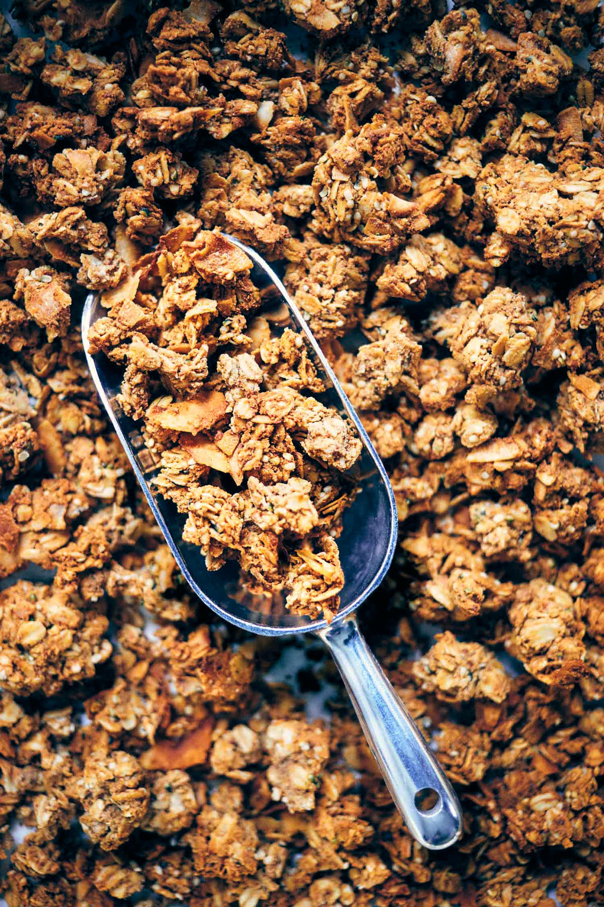 Close up of finished nut pulp granola with a scoop 
