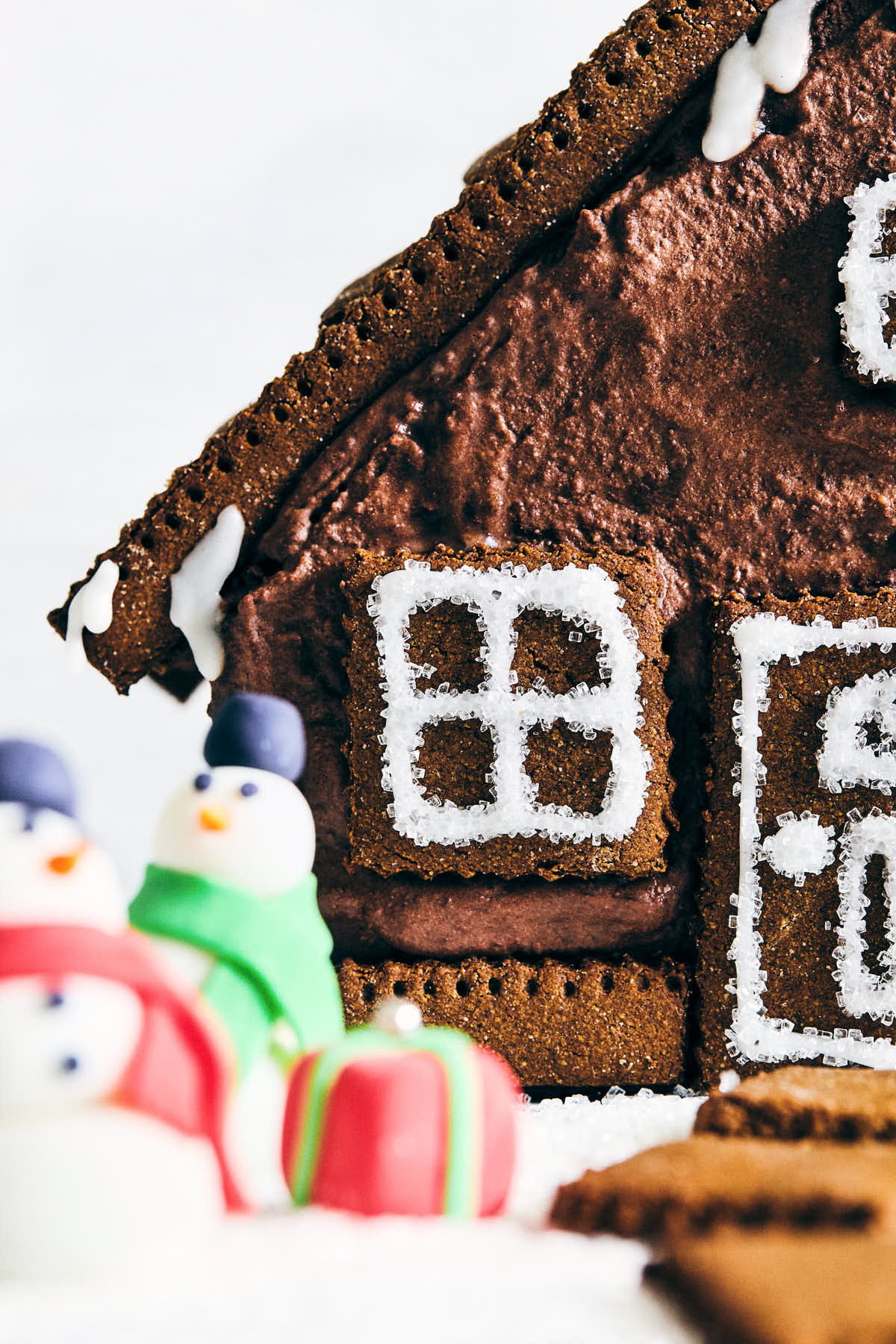 Close up of gingerbread house window and door