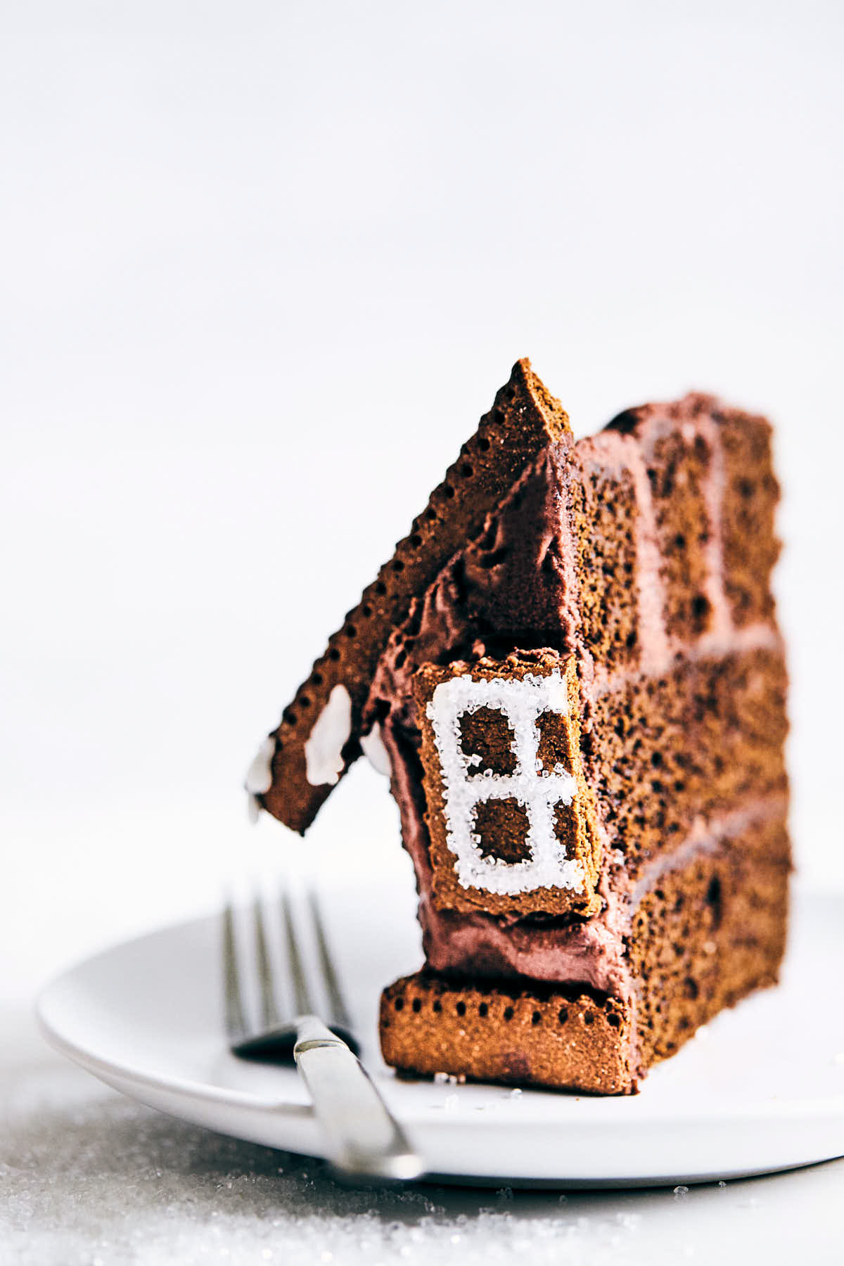 Slice of gingerbread house with a fork