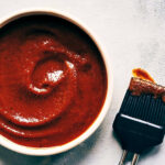 Close up of homemade barbecue sauce showing final texture in a bowl