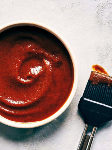 Close up of homemade barbecue sauce showing final texture in a bowl
