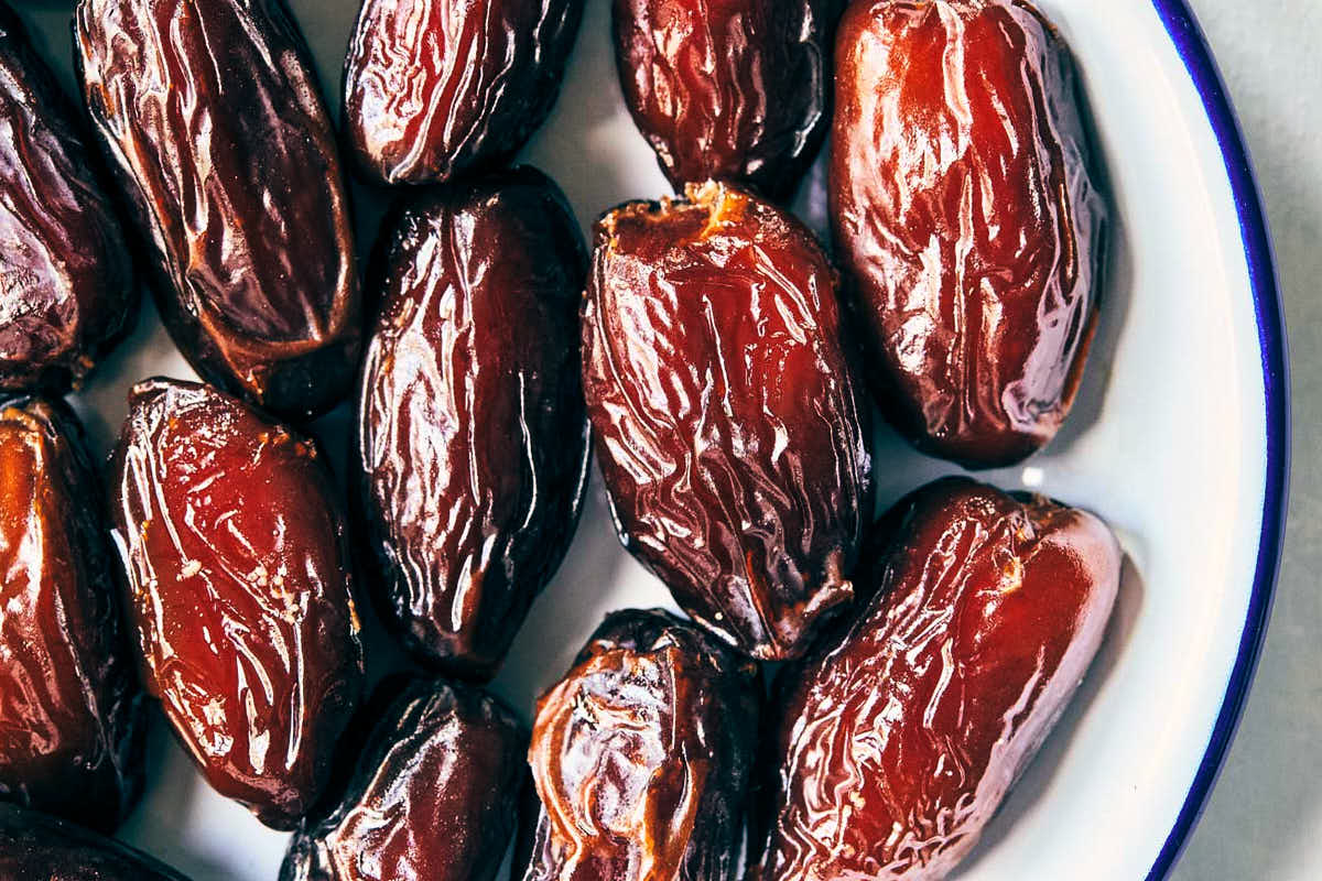 Close up of dates sitting in a plate before cooking process starts