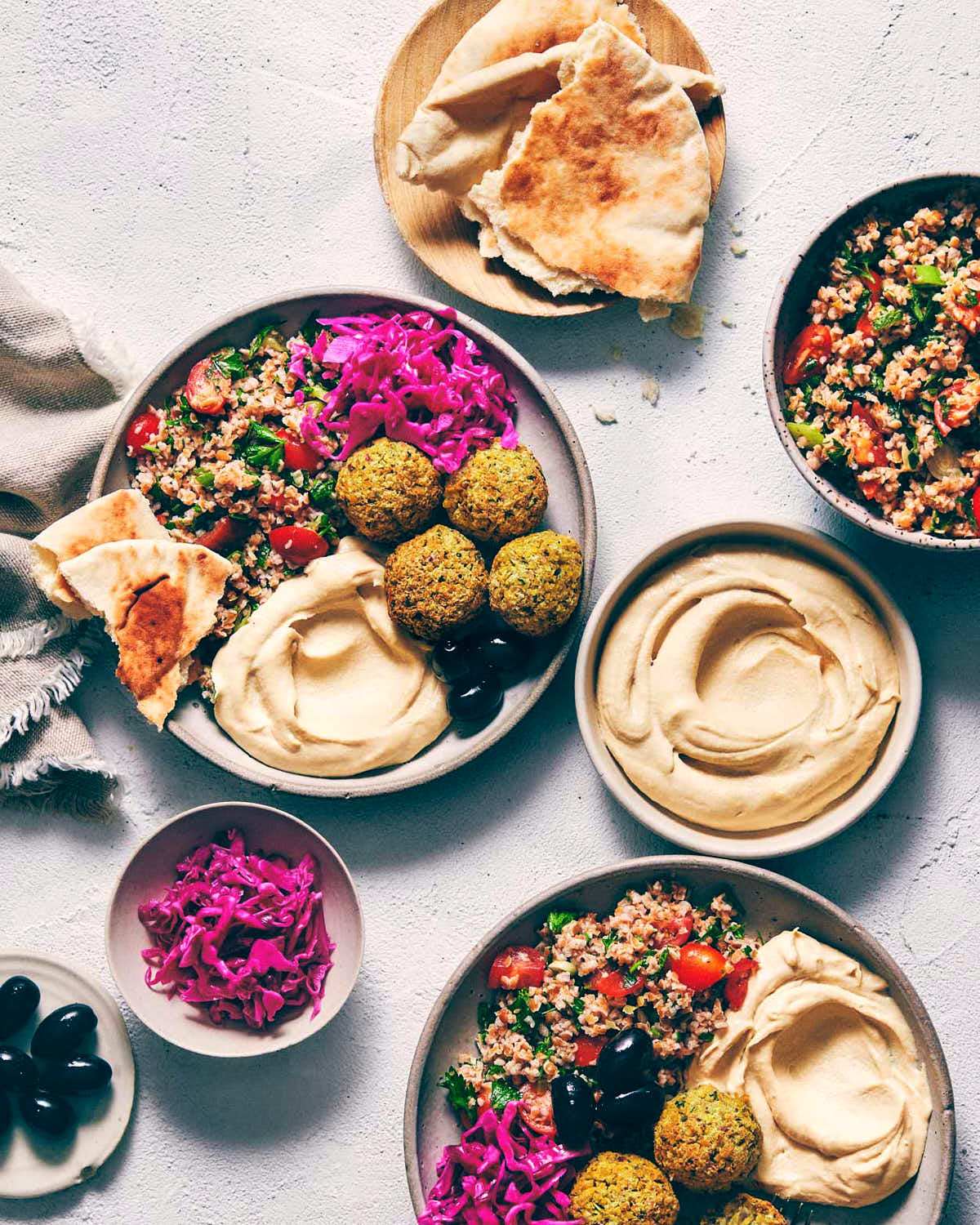 Plate of falafel with hummus, pita and pickled red cabbage