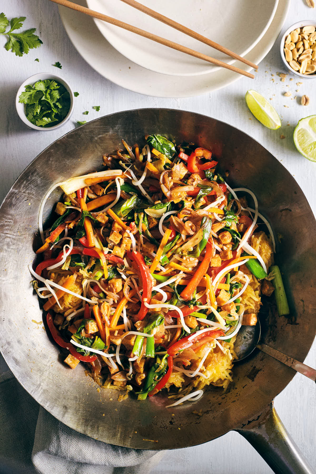 Spaghetti squash pad thai being cooked in a wok
