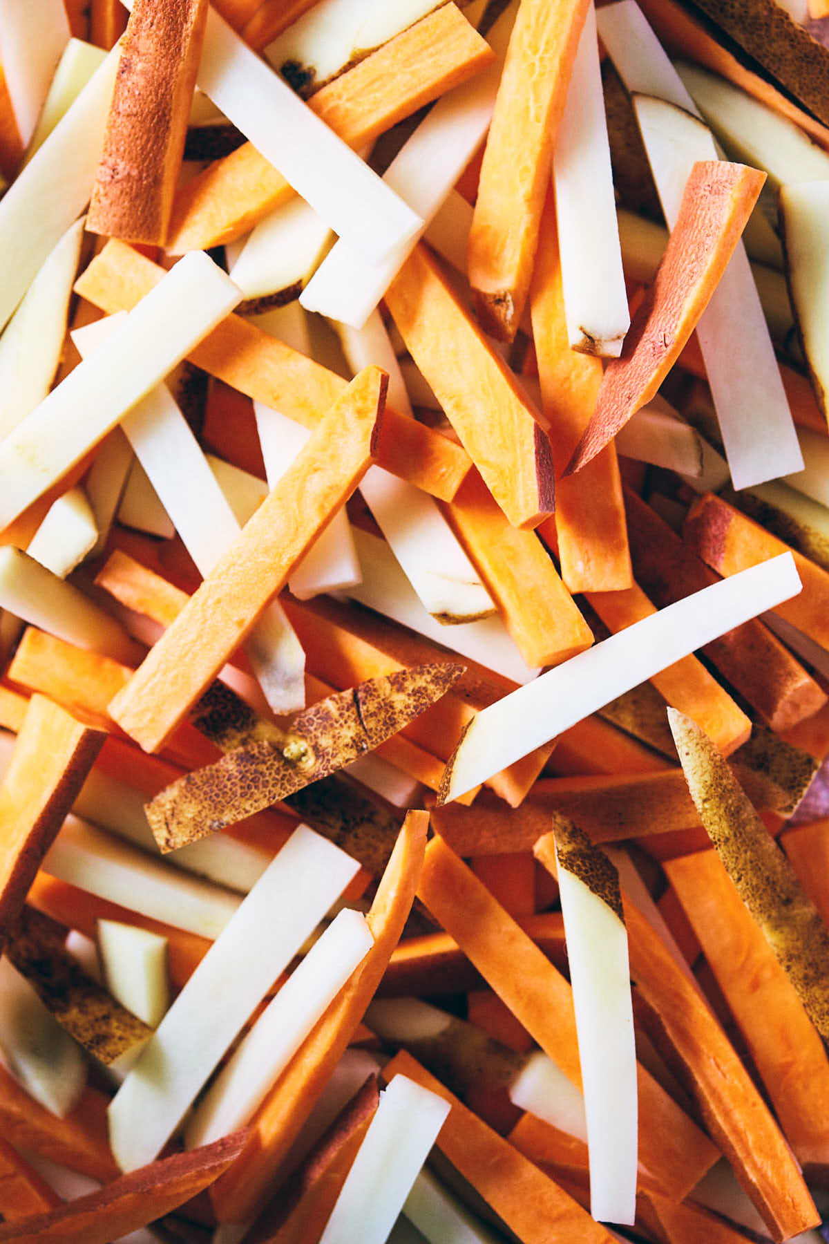 Mix of sweet and russet potatoes cut into long string for chili fries