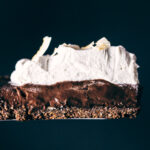 Slice of chocolate coconut cream pie being served