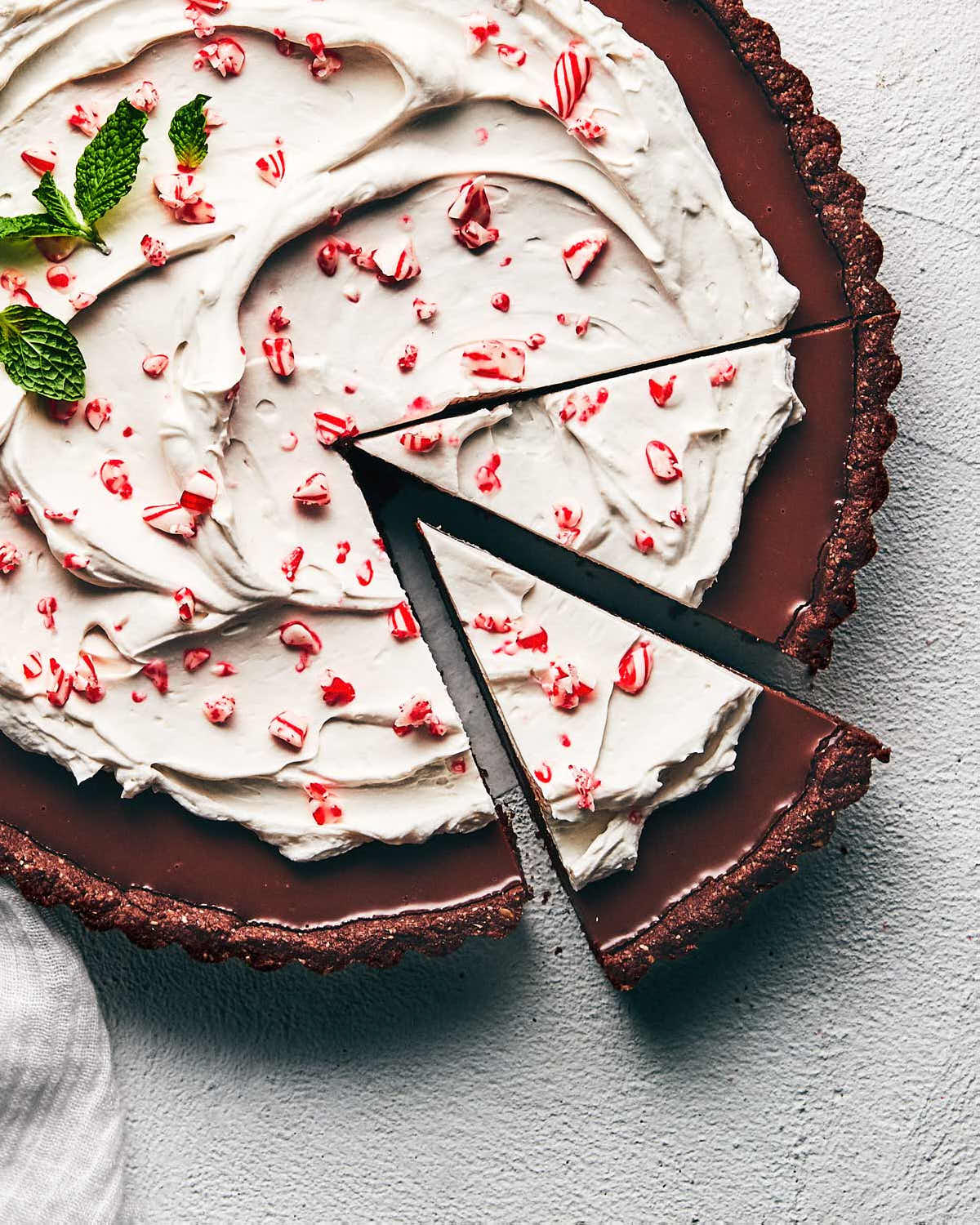 Sliced chocolate peppermint tart ready to be enjoyed