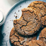 Stack of ginger molasses cookies on a grey plate
