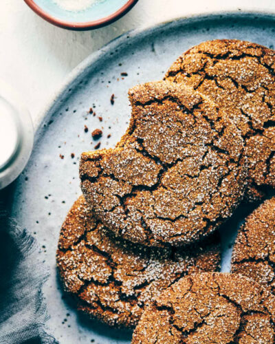 Stack of ginger molasses cookies on a grey plate