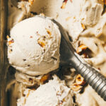 Close up of whiskey hazelnut ice cream being scooped