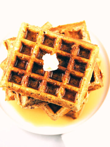 Whole wheat buttermilk waffles with maple syrup and melted butter