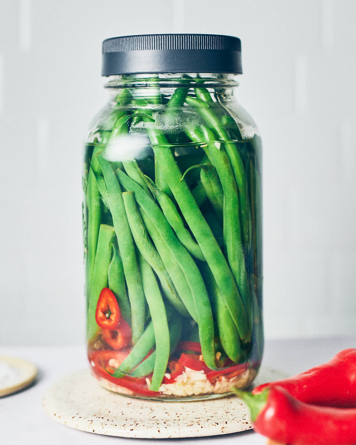 Assembled jar of quick pickled green beans before going into the refrigerator