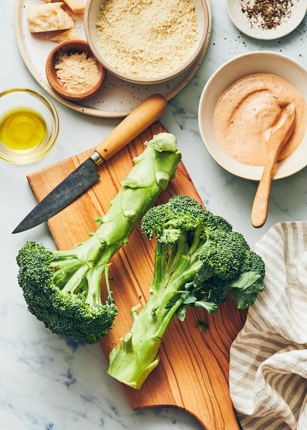 Ingredients needed for air fryer broccoli fries including broccoli, olive oil and panko