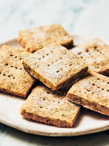 Best Earl Grey Shortbread cookies, sprinkled with sugar, on a while plate