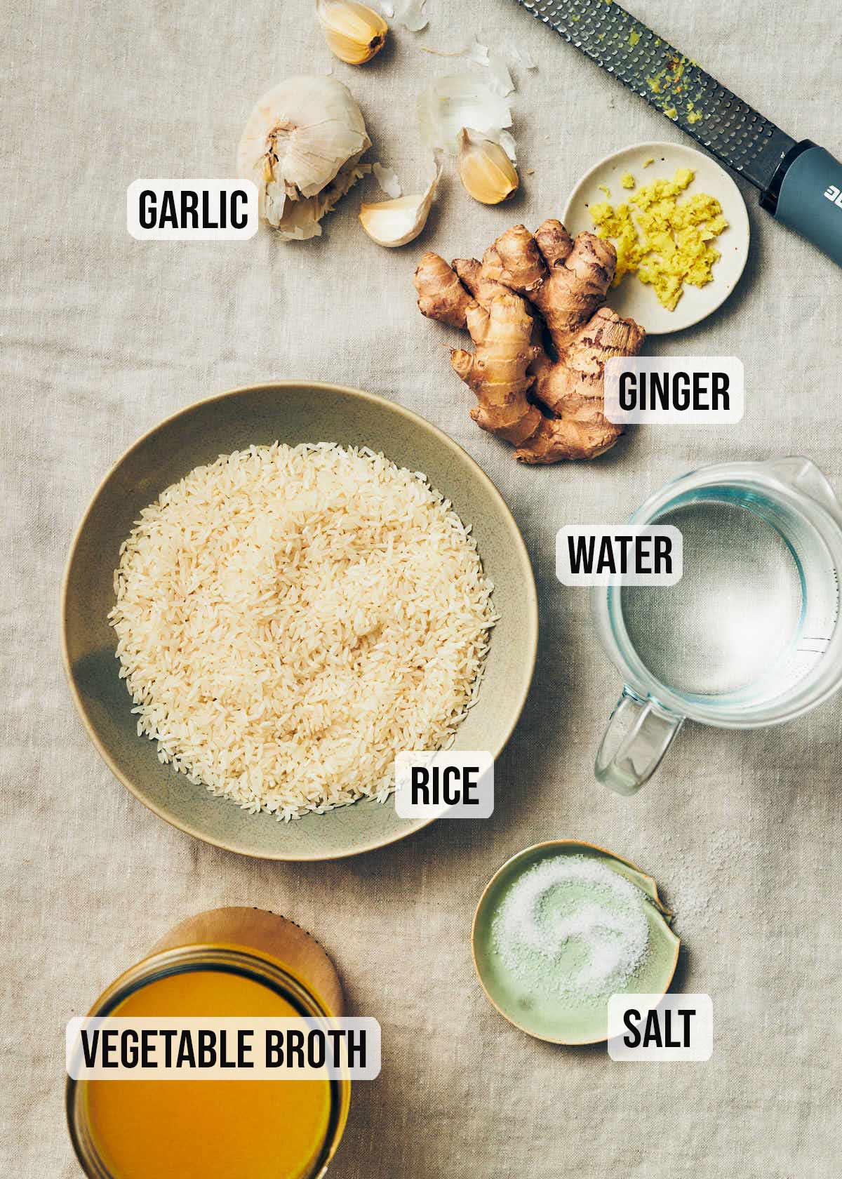 Ingredients to make vegan congee: rice, vegetable stock, water, salt, ginger, garlic.