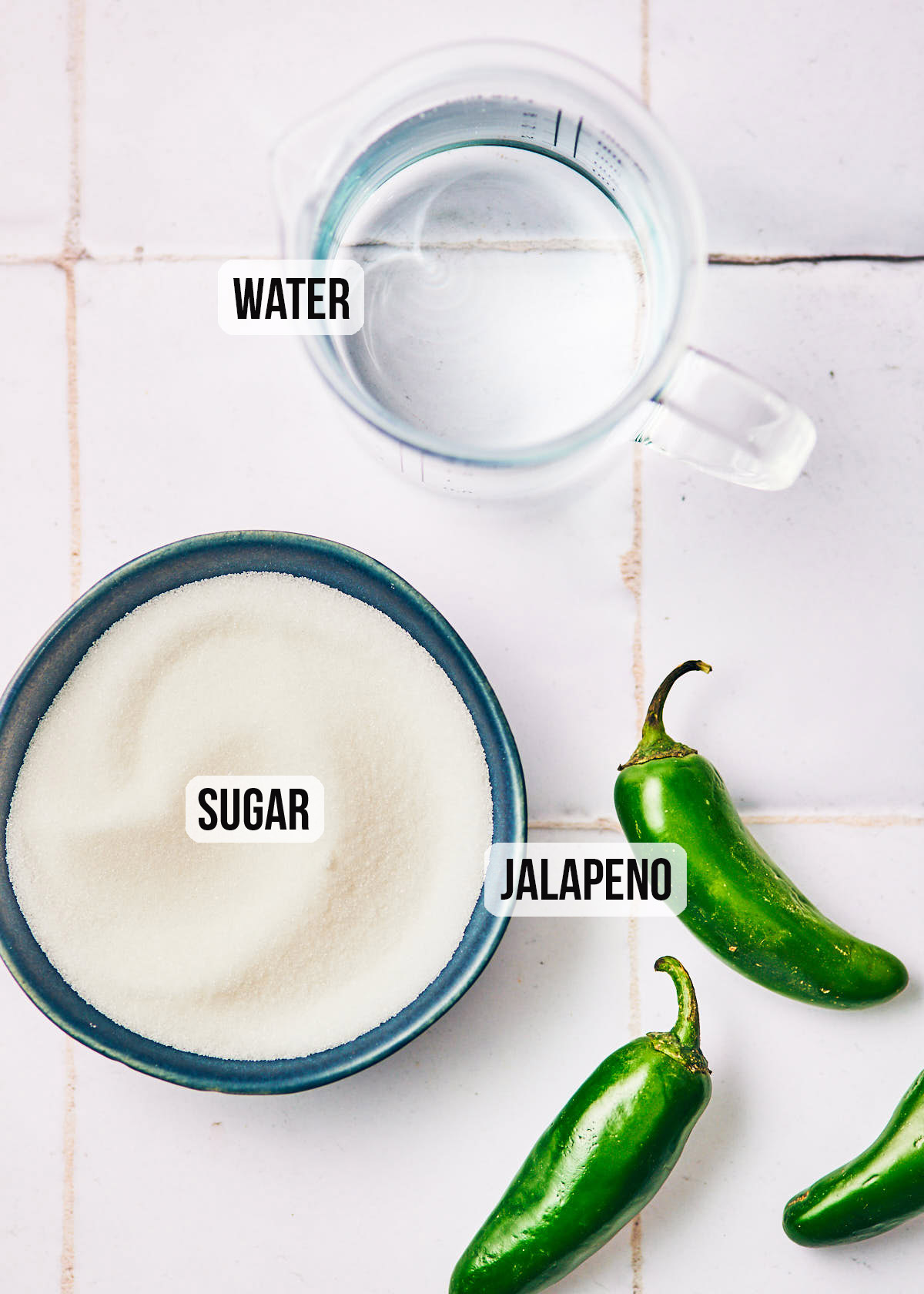 Ingredients to make the best Jalapeño Simple Syrup: sugar, water, jalapeño.