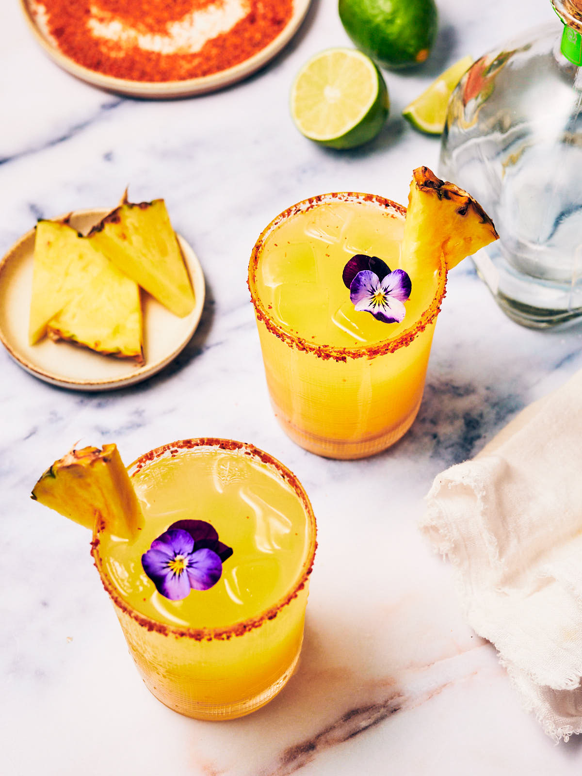 Spicy Pineapple Margarita cocktails made with the best Jalapeño Simple Syrup.