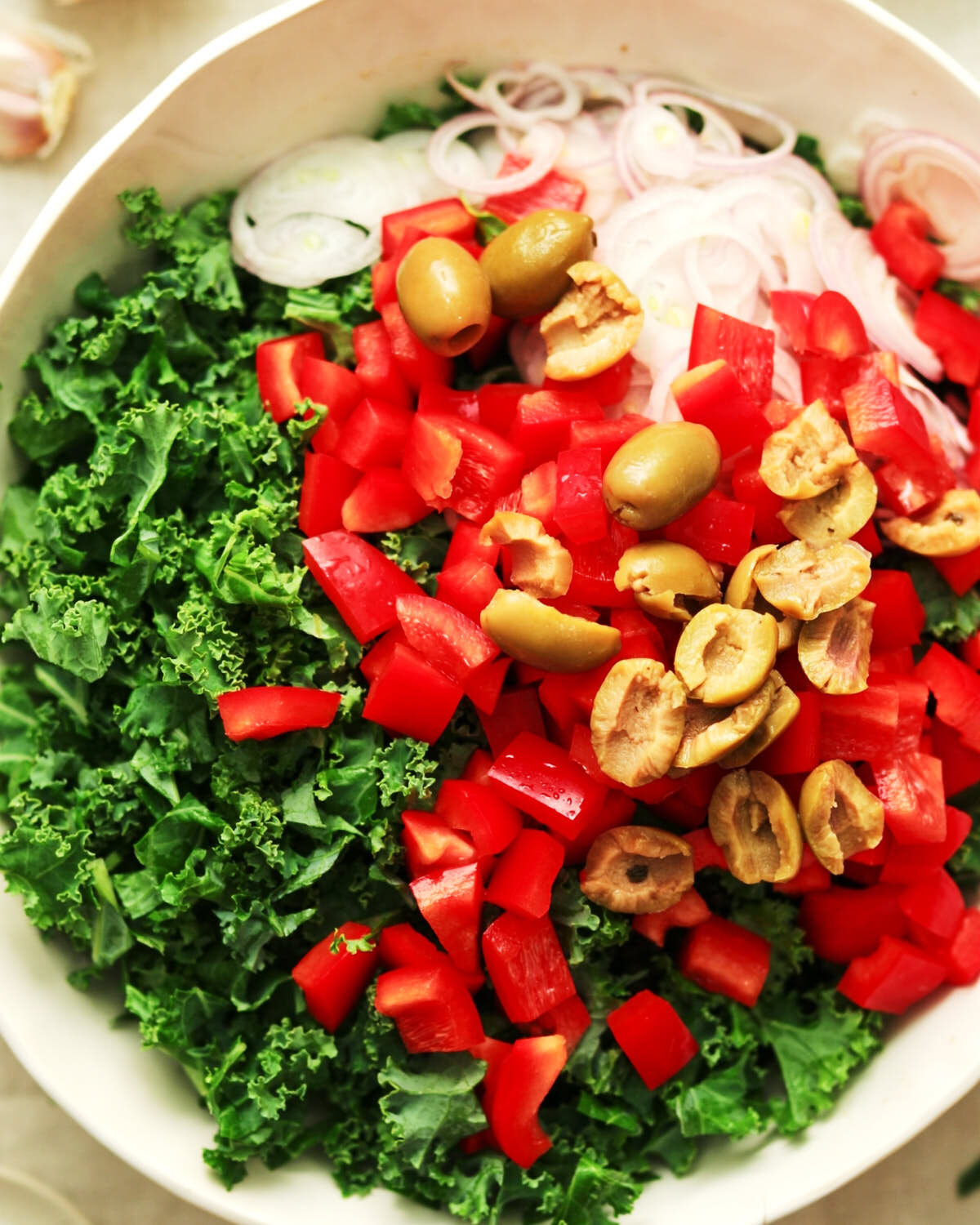 Ingredients in a bowl for vegetarian Black Lentil Salad with Feta.