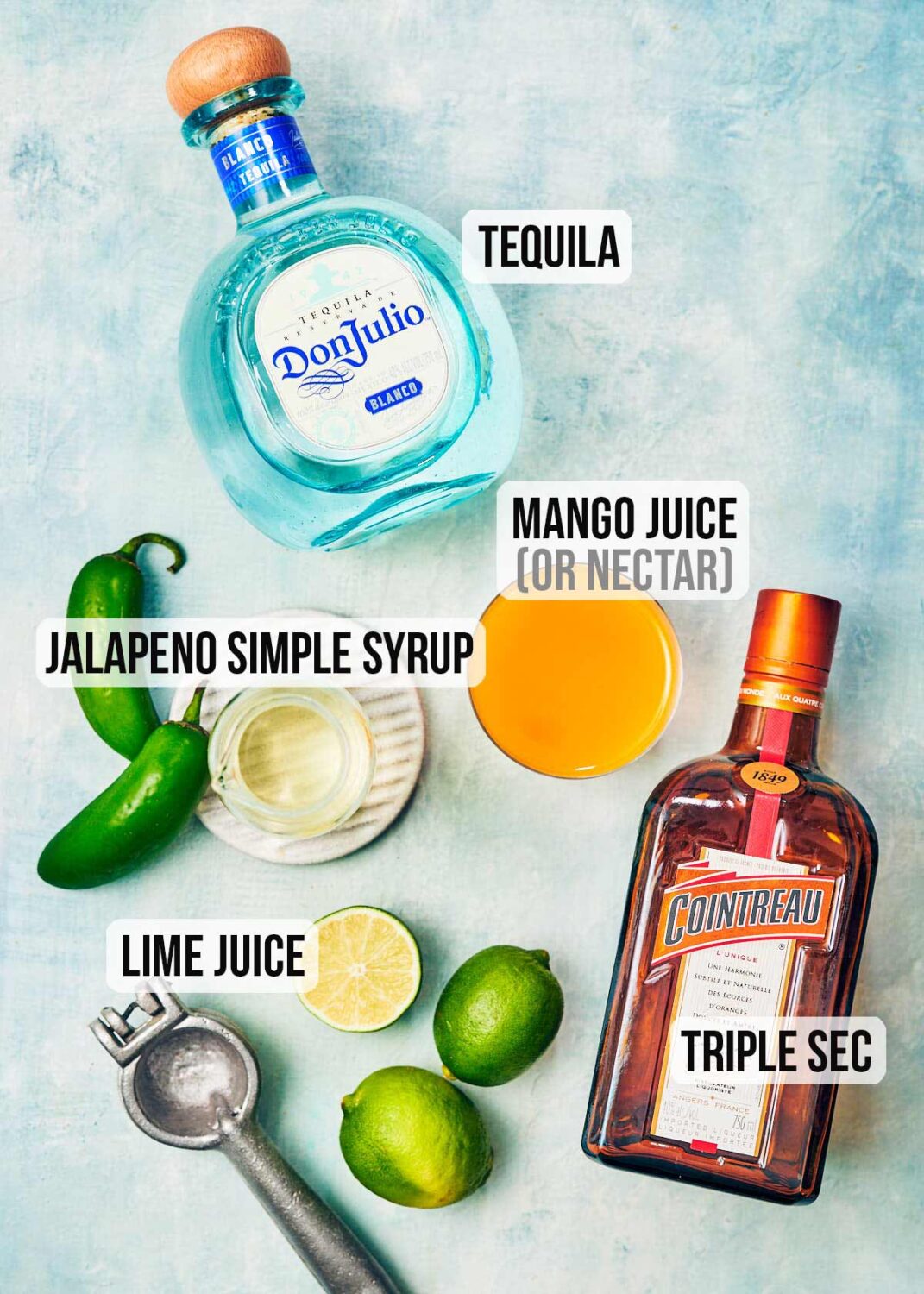Ingredients to make Spicy Mango Margarita cocktails with jalapeno.