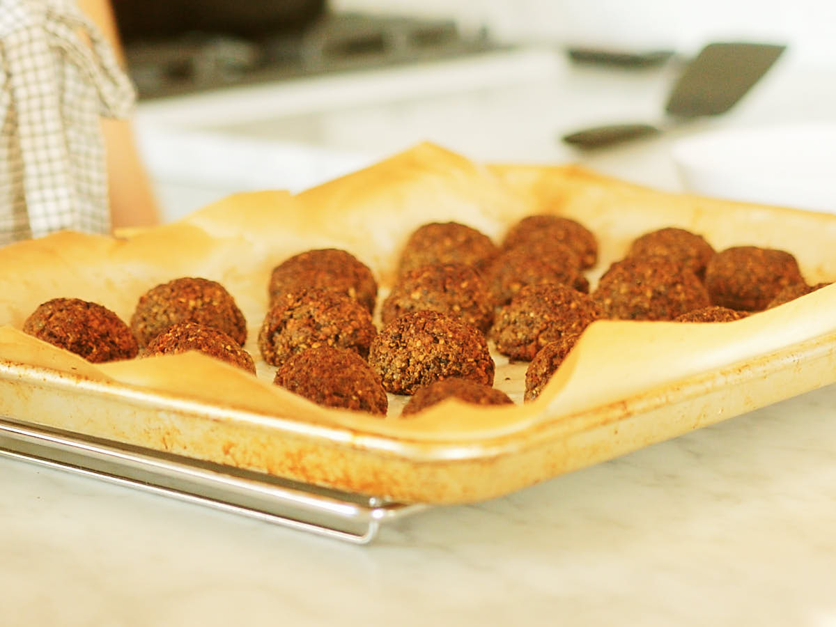 Evergreen Kitchen's Meatless Meatballs on a baking sheet out after baking.
