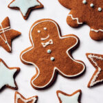 Vegan gingerbread cookies decorated with royal icing.