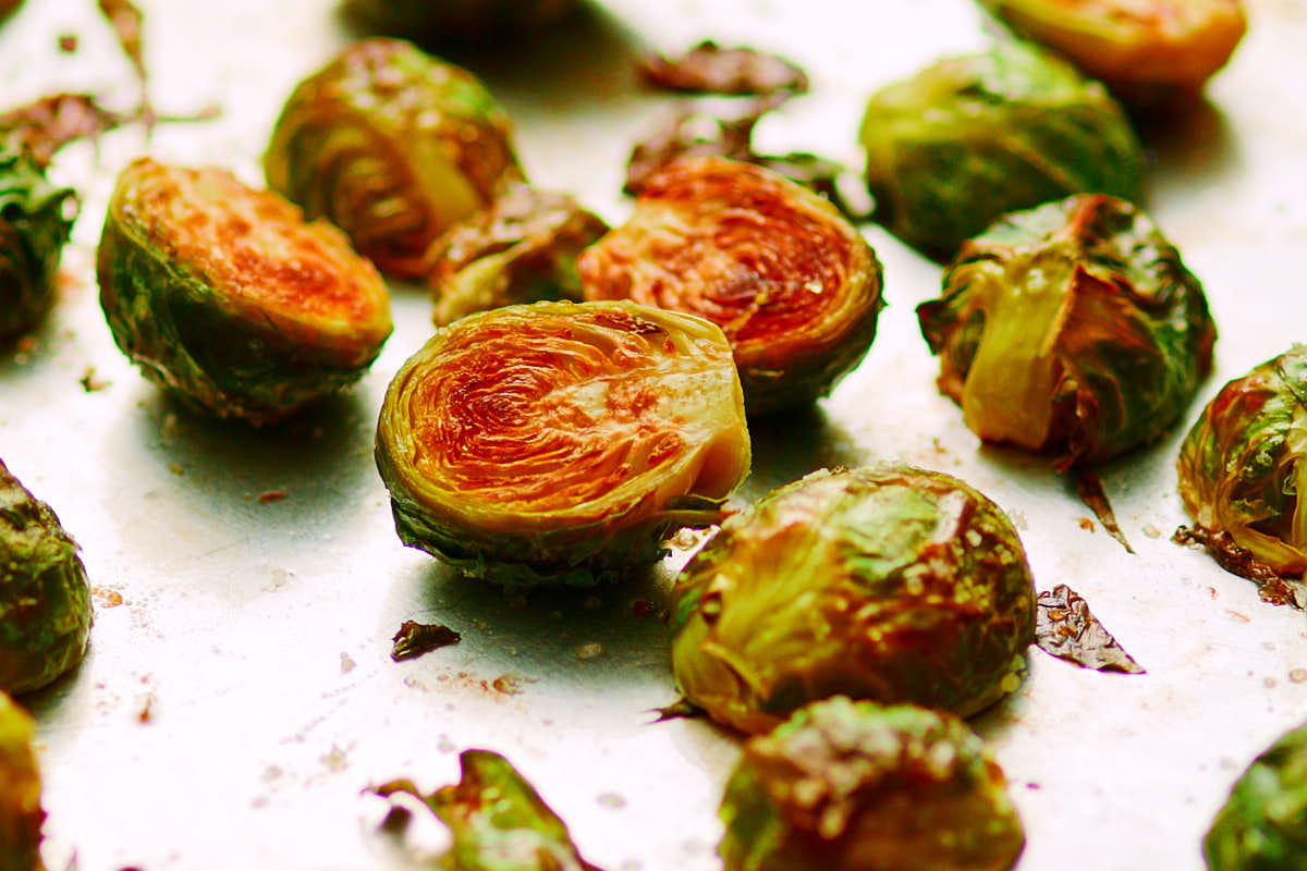 Brussels sprouts roasted in oven before adding maple sriracha glaze.