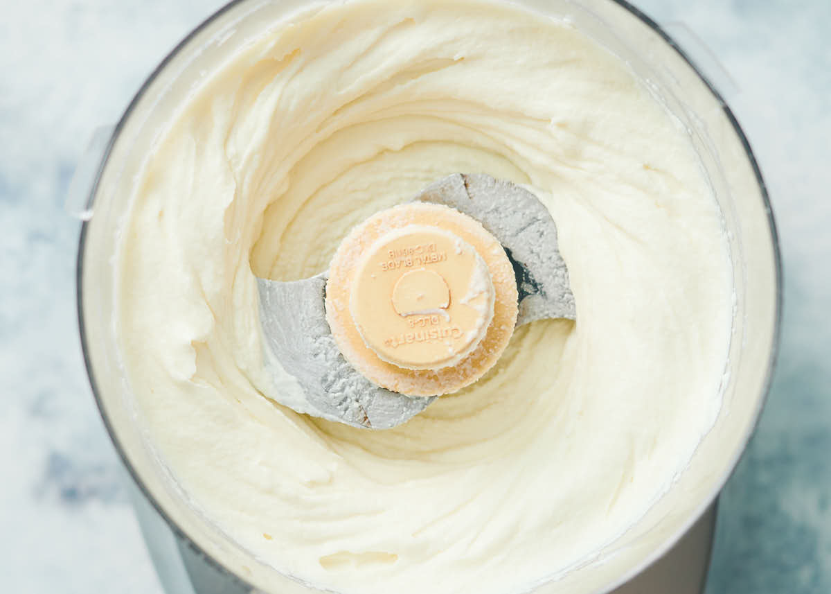 Creamy whipped ricotta in a food processor. 