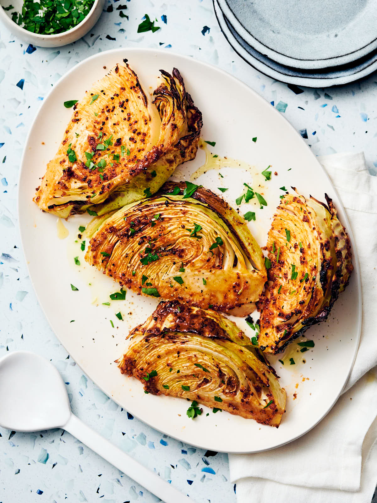 Wedges of air fryer cabbage wedges on a serving platter.