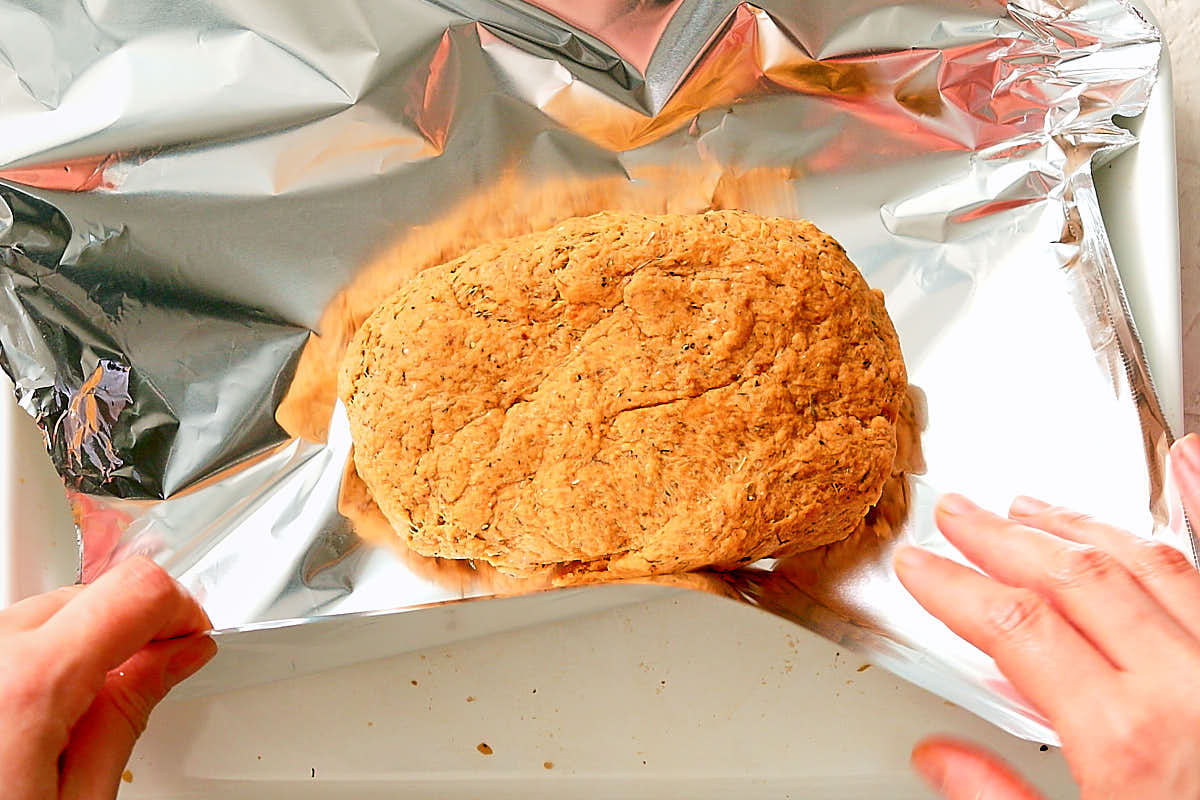 Shaping seitan into a block and wrapping in tinfoil before baking.