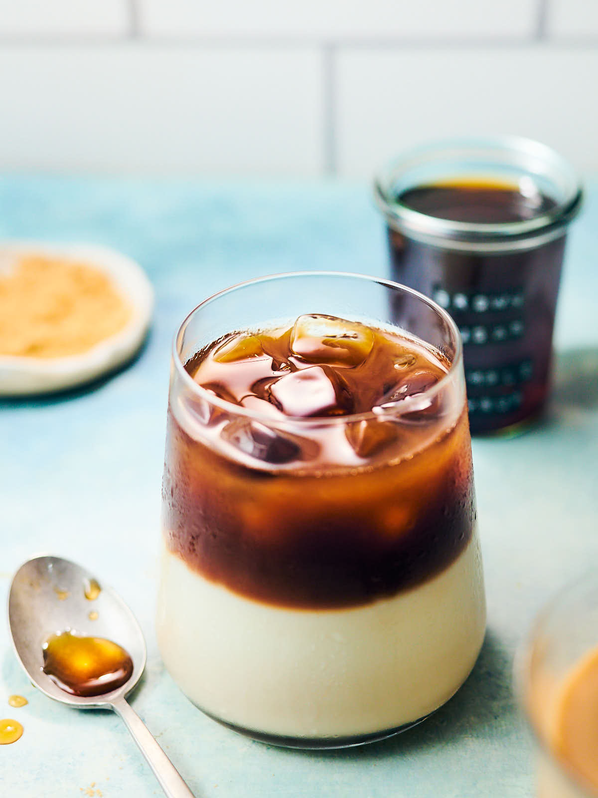 Iced coffee latte in a glass with brown sugar simple syrup.