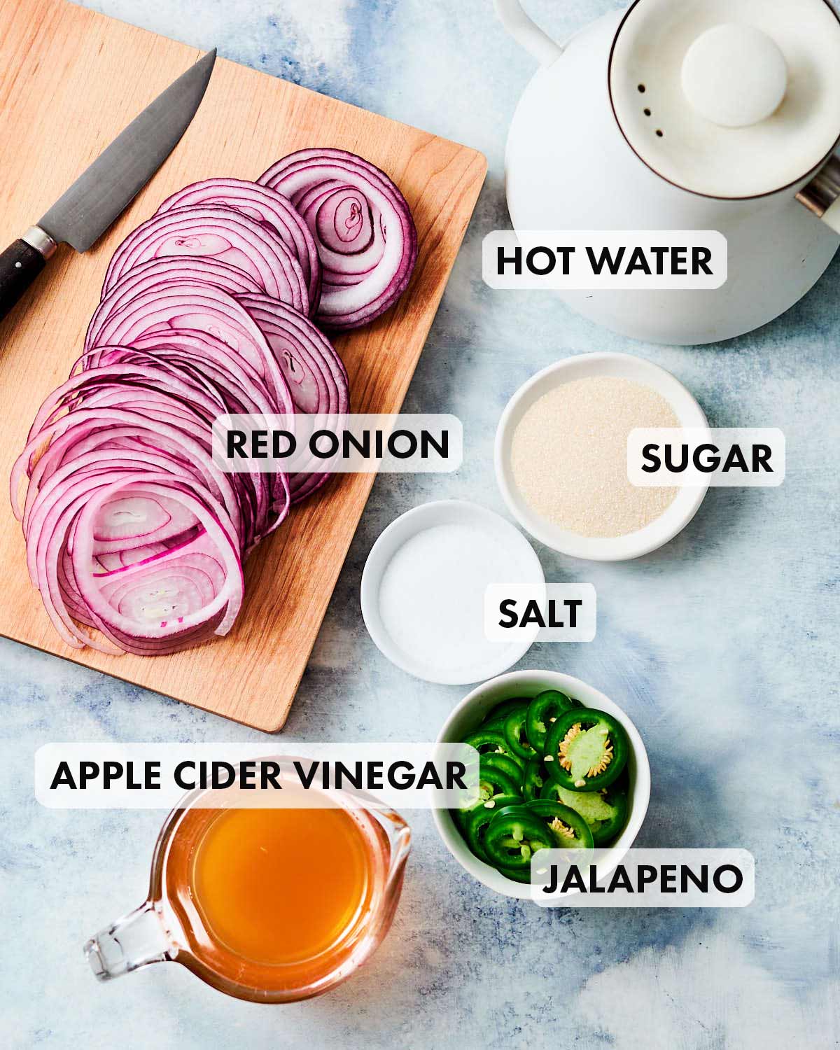 Ingredients to make quick pickled red onions and jalapenos.