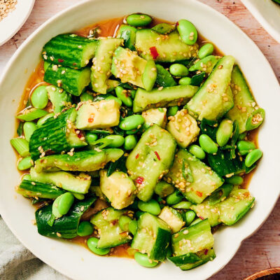 Easy Spicy Cucumber Salad with edamame and avocado in a serving bowl.