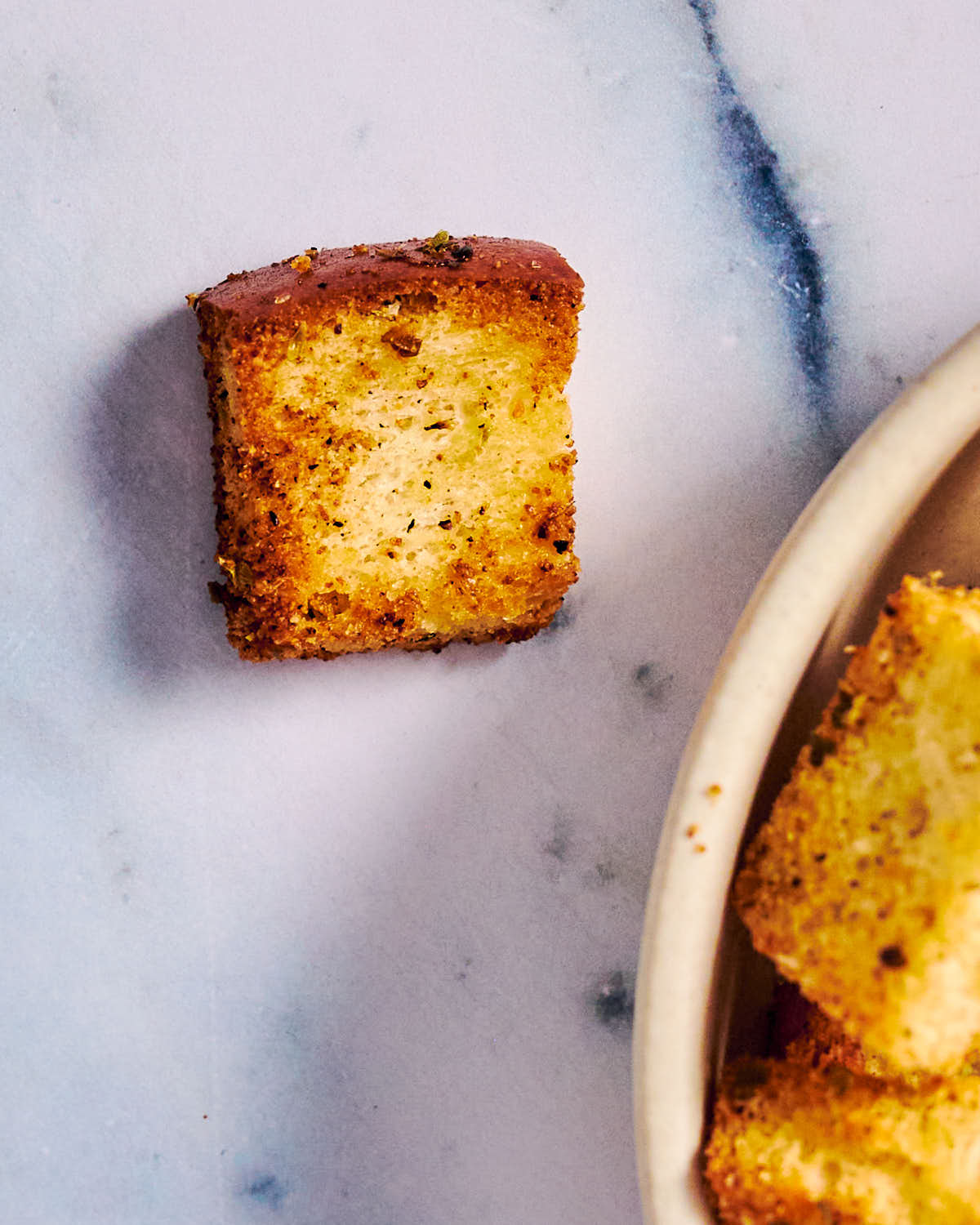 Seasoned air fryer croutons made from white sandwich bread.