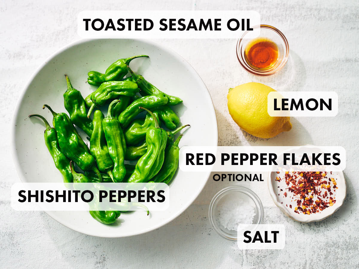 Ingredients to shishito peppers in the air fryer including lemon and sesame oil.