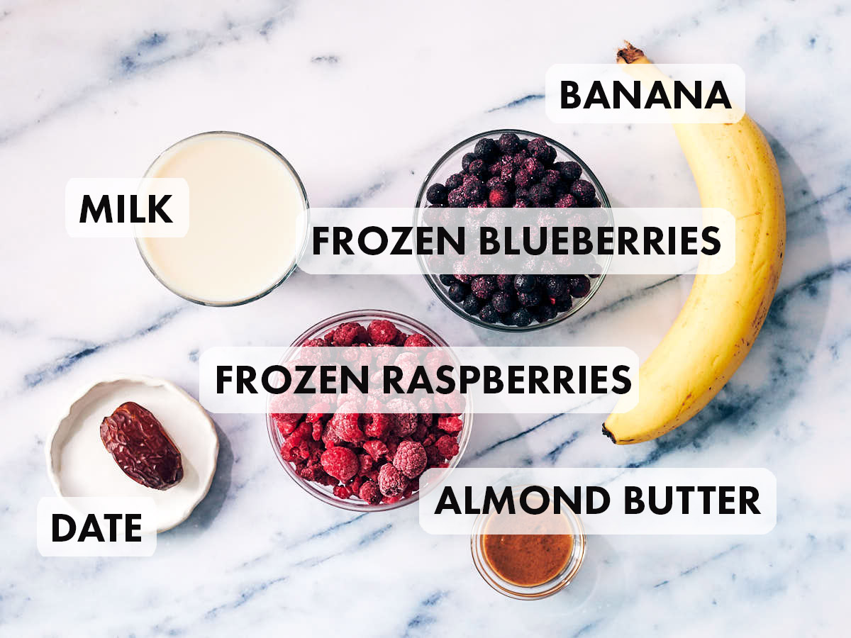 Ingredients to make a blueberry raspberry smoothie.