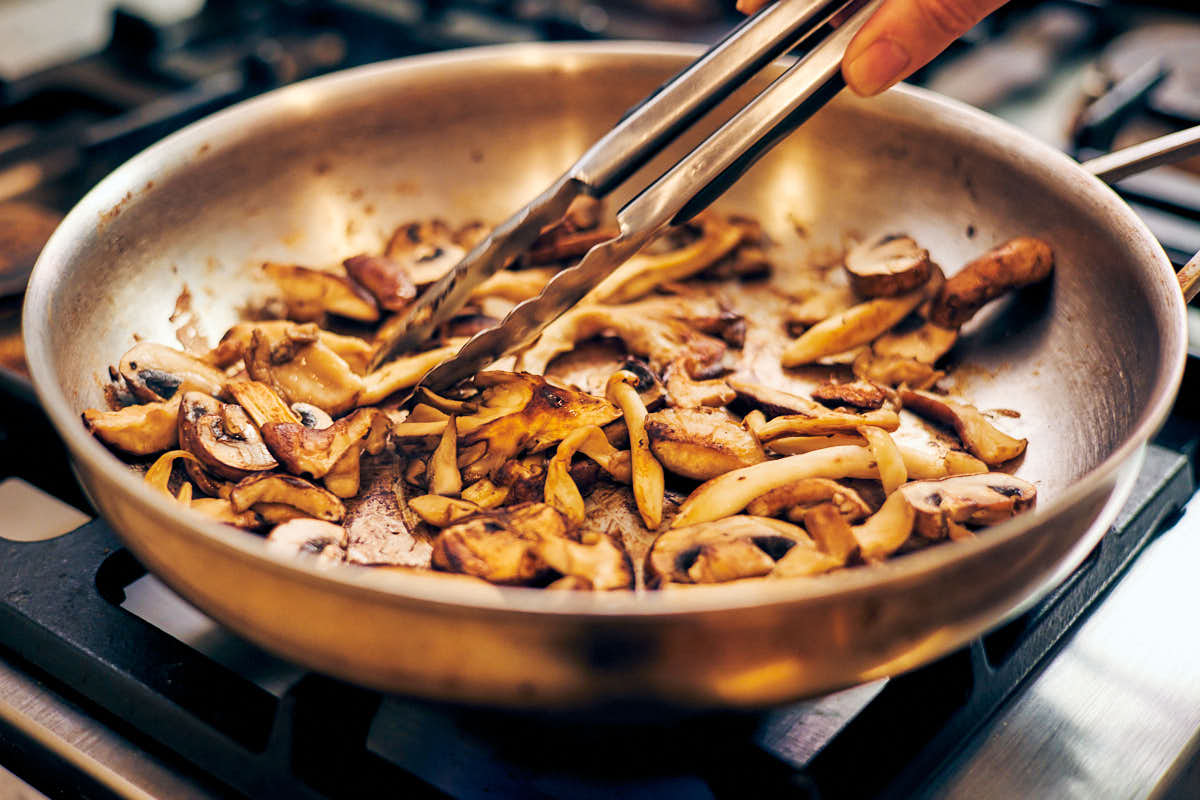 Dry searing mushrooms in a skillet for miso pasta.