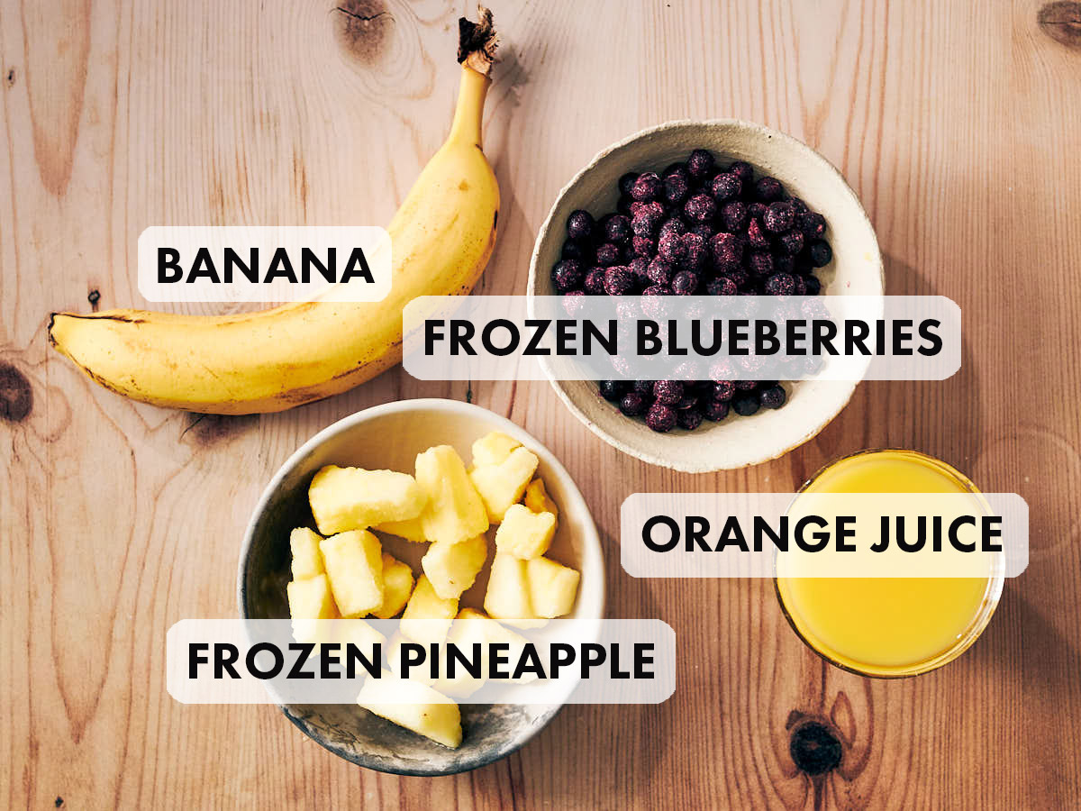4 ingredients to make blueberry pineapple smoothies, including banana and orange juice.