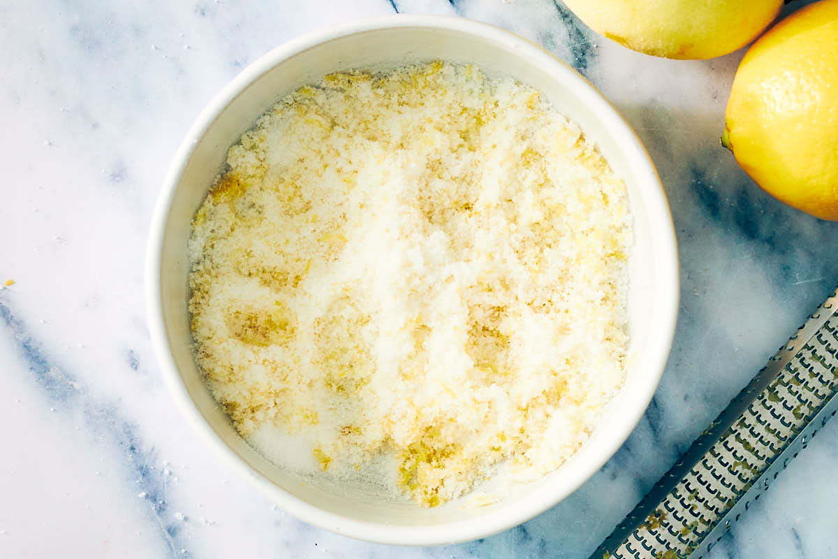 Lemon zest mixed with sugar in a bowl.