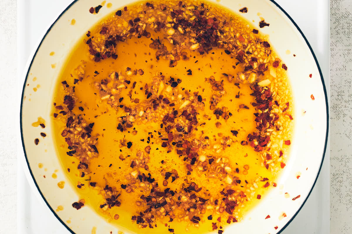 Homemade chili garlic oil in a saucepan.