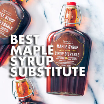 Maple syrup bottles on a marble counter.