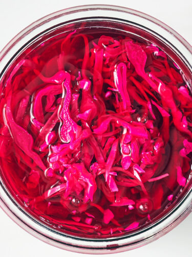 Quick pickled red cabbage in a glass jar.