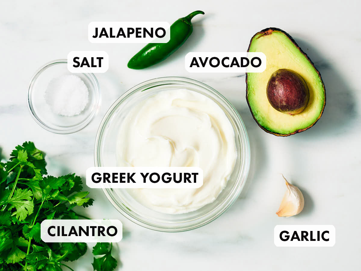 Ingredients to make yogurt sauce recipe with cilantro, avocado, and jalapeno. 