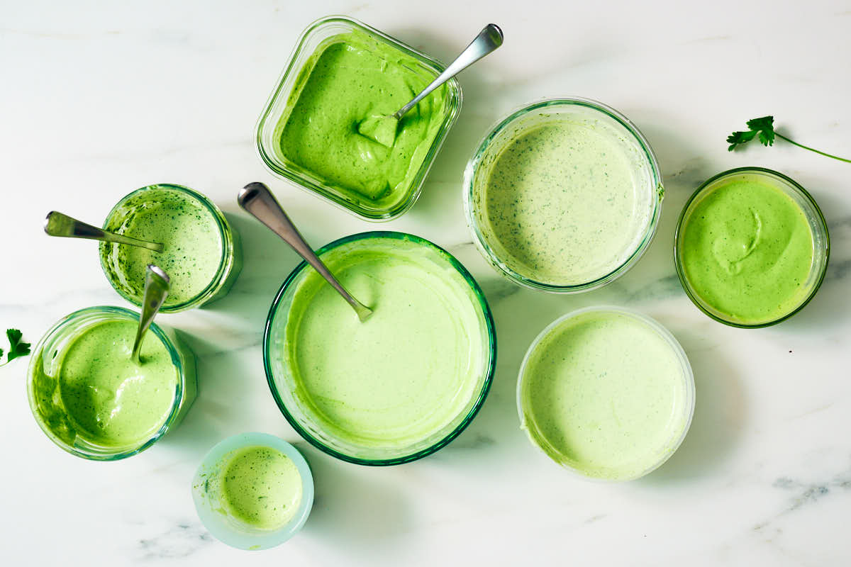 Different cilantro yogurt sauces in bowls after recipe testing. 