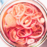 Easy Quick Pickled Shallots in a glass jar.
