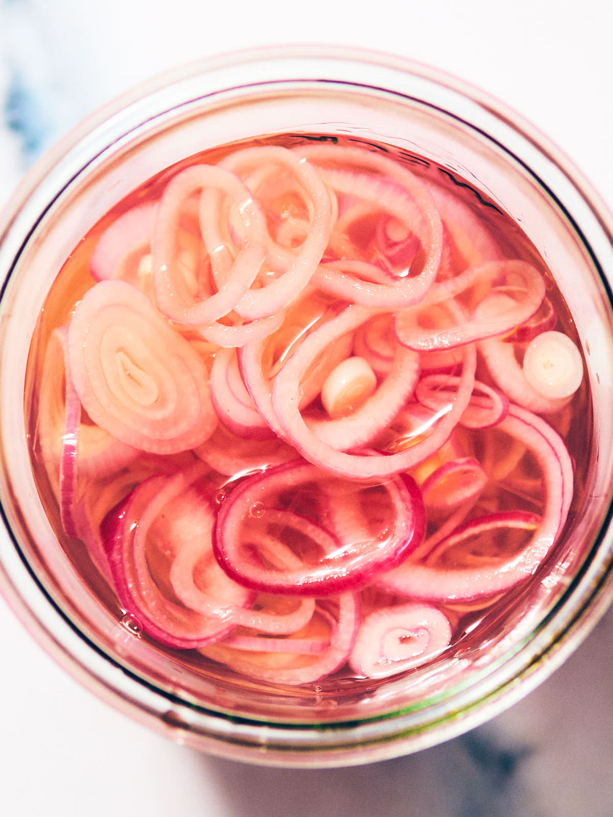 Easy Quick Pickled Shallots in a glass jar.